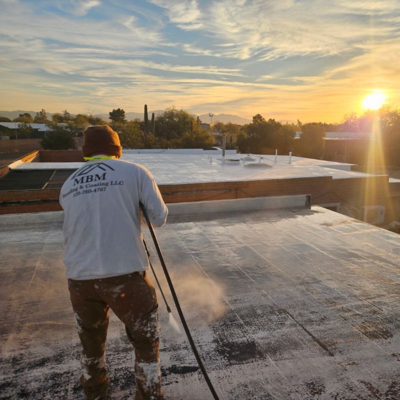 Technician Power Washing Roof for Coating