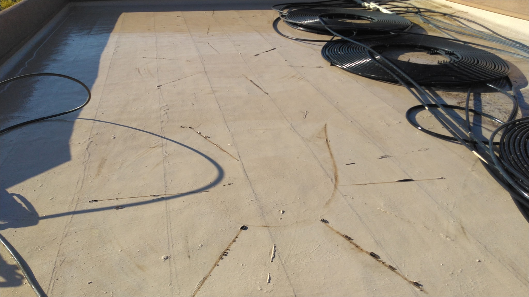 Roof damage exposed after rooftop pool-heating coils were removed