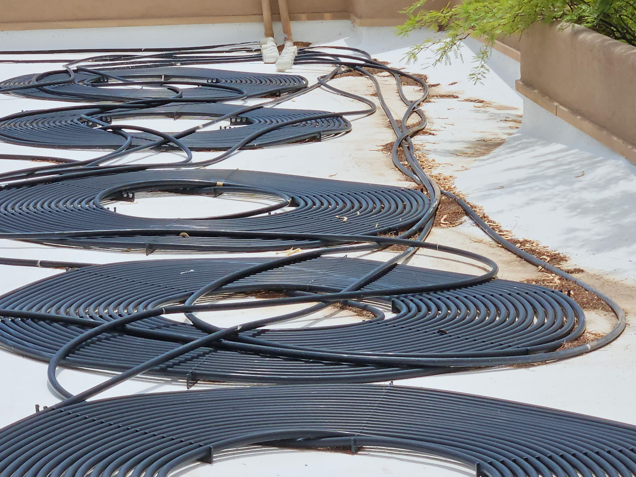 Rooftop pool heating coils